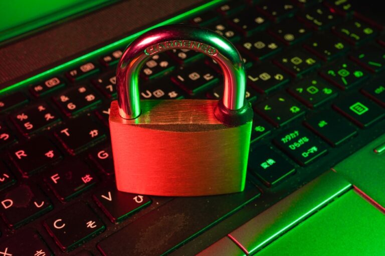 Digital padlock with glowing green checkmark overlaying a laptop screen showing a secure website with HTTPS in the address bar"
