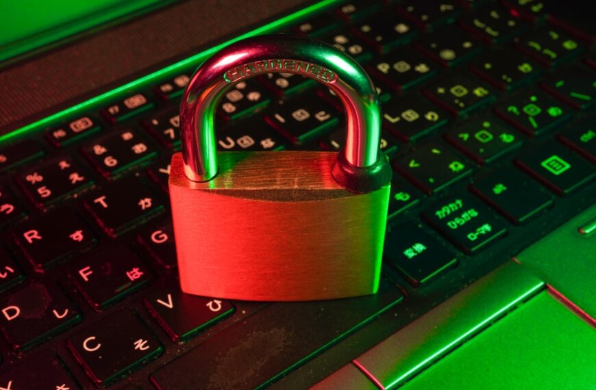 Digital padlock with glowing green checkmark overlaying a laptop screen showing a secure website with HTTPS in the address bar"